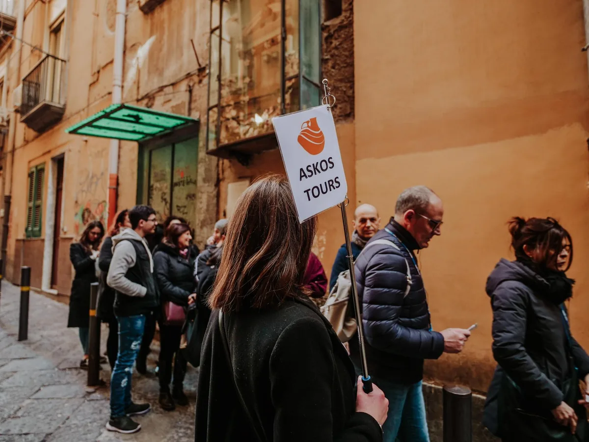 A guide leading a small group through the old town